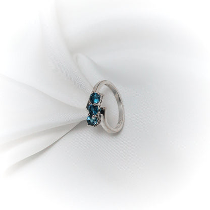 Equilibrium – Asymmetrical Blue Topaz Liberation Ring